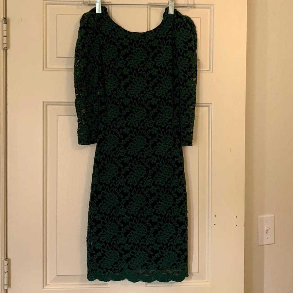size 1/2 green and black MIDI dress with open back. Great for wedding or club
